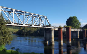 Ngāruawāhia rail bridge, where children jumping off into the water have been hit and killed by trains.