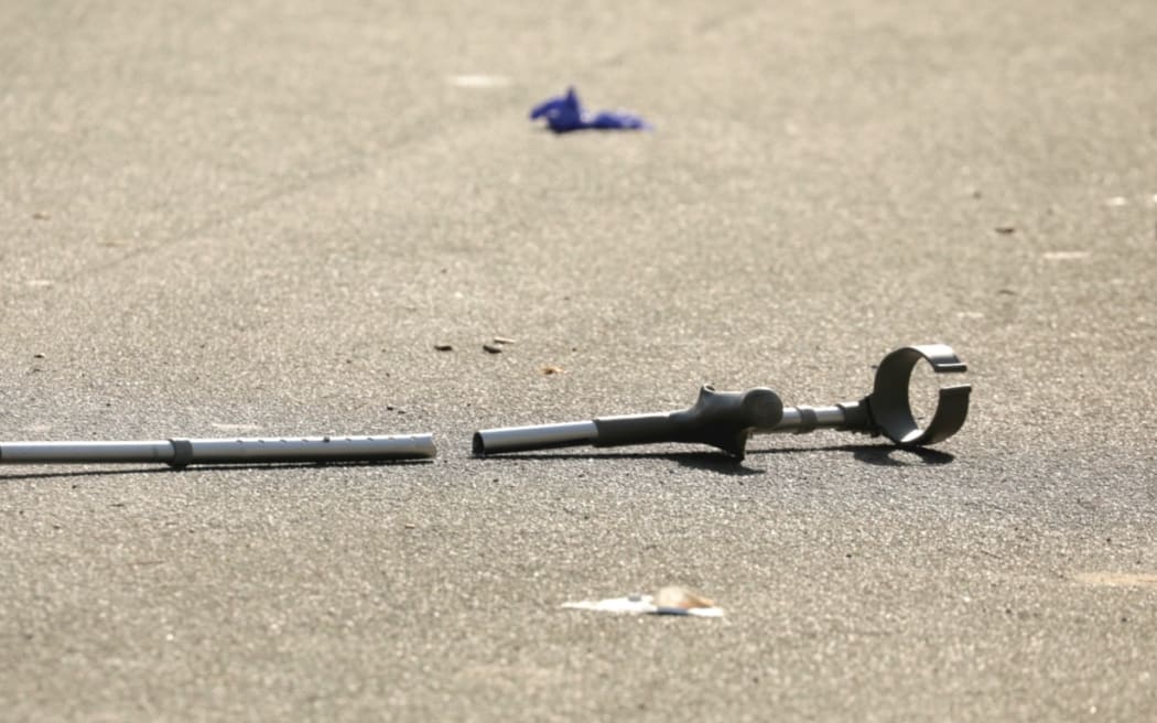 A crutch on the ground after an incident at Murrays Bay on the North Shore on 23 June 2022.