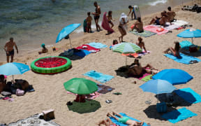 People enjoy a day out at the beach in Platja d'Aro