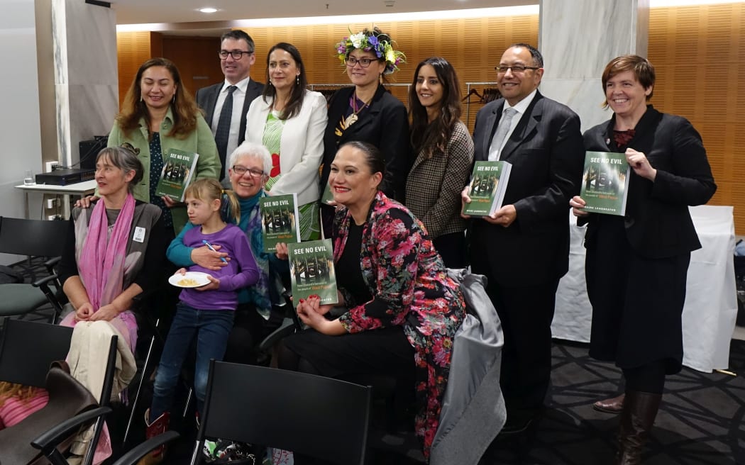 Author Maire Leadbeater (with niece on lap) surrounded by New Zealand MPs at the launch of her book 'See No Evil: New Zealand's betrayal of the people of West Papua'.