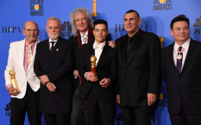 Bohemian Rhapsody winner Rami Malek poses with Graham King (second from right), Brian May (third from left) and Mike Myers (far right) during the 76th annual Golden Globe Awards.