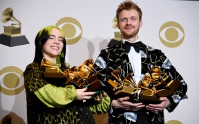18-year-old pop star Billie Eilish and her brother and producer Finneas O'Connell with their combined Grammys haul.