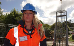 Dunedin City Council infrastructure and networks general manager Ruth Stokes helps install the new pump screen.