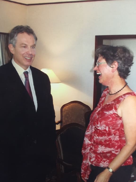 Tony Blair and Eva Radich share a laugh post-interview on RNZ National's Nine to Noon in 2006