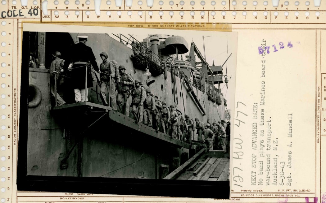 Next Stop Advanced Base. US Marines leaving New Zealand for Guadalcanal. Sgt. James A, Mundell wrote; "No band plays as these Marines board their war-bound transport" 30 June 1943.