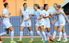Paige Satchell and Football Ferns team celebrate her goal.
