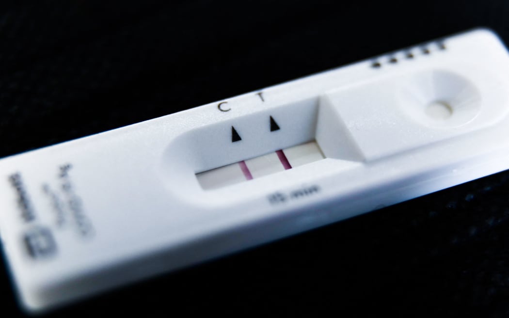 A positive result of rapid antigen test is seen in this illustration photo