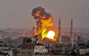 A fireball exploding in Gaza City during Israeli bombardment.