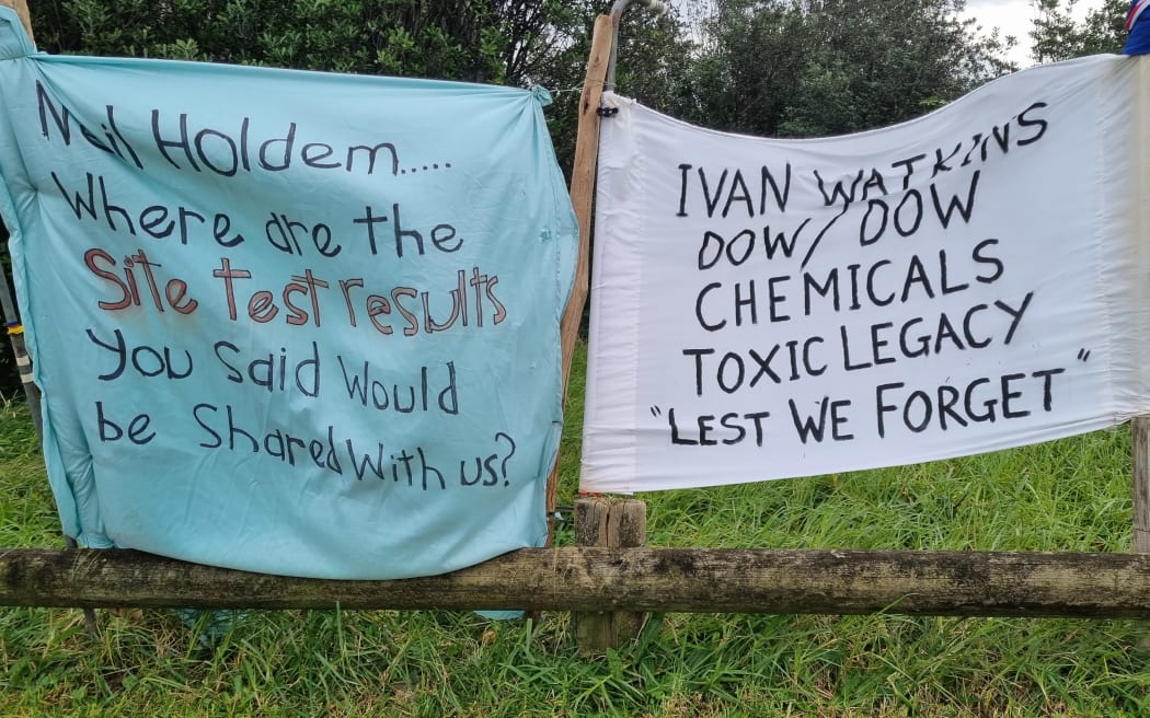 Banners at Luke and Justin Selby's makeshift campsite at the boundary of the former Ivon Watkins Dow chemical plant.