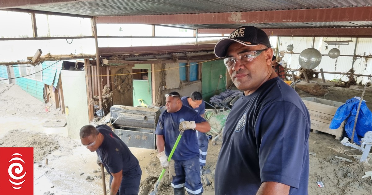 Firefighters from Fiji get stuck into the cyclone cleanup