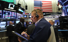 Traders on the floor of the New York Stock Exchange (NYSE) on October 4, 2018 .