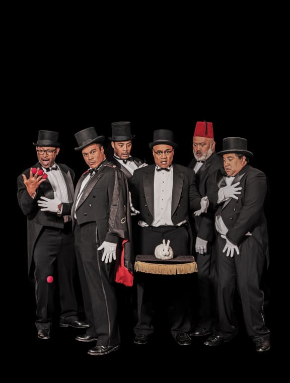 Poster image for the show 'The Naked Samoans Do Magi' showing the cast dressed in tuxedos, gathered around a white rabbit.