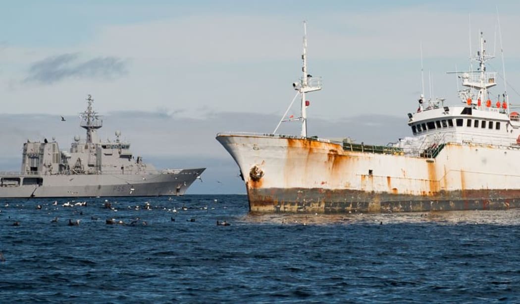 HMNZS Wellington (L) gathering evidence of illegal fishing in Antarctic waters.