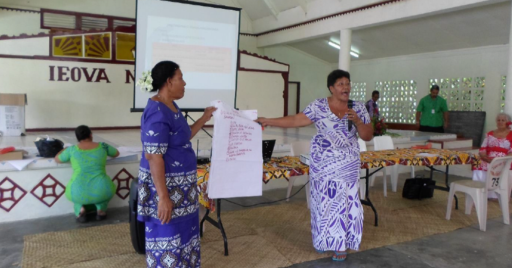 Women present their findings during public consultations.