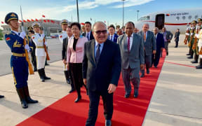 Papua New Guinea's prime minister Peter O'Neill arrives in Beijing for a 'Belt and Road' summit, 25 April 2019.