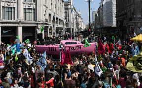 Environmental protesters from the Extinction Rebellion group block the junction of Oxford Street and Regent Street in London on April 15, 2019.