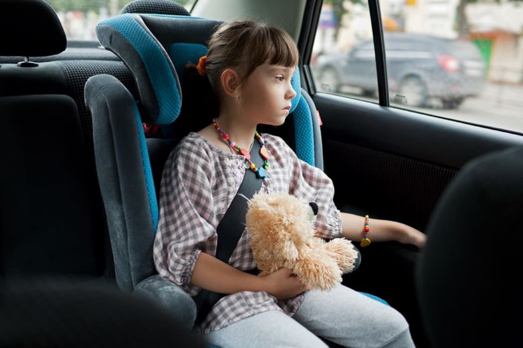 Children should not be left alone in parked cars and should be in an approved child restraint.