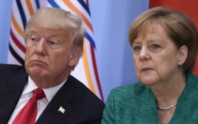 US President Donald Trump, left, and German Chancellor Angela Merkel at a panel discussion at the G20 summit in Hamburg, Germany.