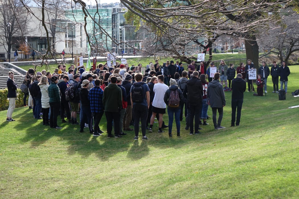 Some Otago University students protest the proctor's destruction of the magazine Critic. This week's edition depicted a pixelated image of a person menstruating.