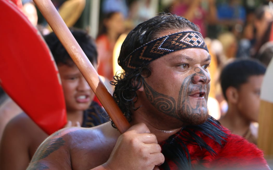 Politicians being welcomed onto Te Whare Runanga on the Treaty grounds at Waitangi in 2023.