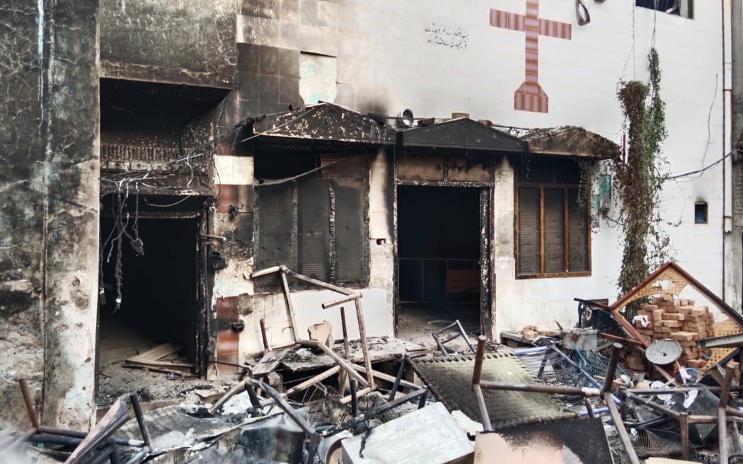 View of a burnt church on the outskirts of Faisalabad on August 16, 2023, following an attack by Muslim men after a Christian family was accused of blasphemy. Photo: AFP / Ghazanfar Majid