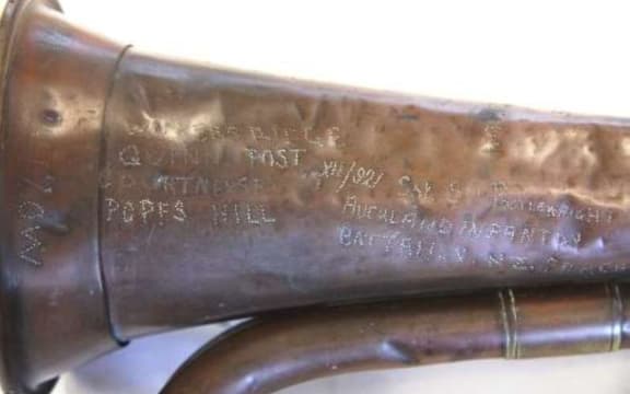 Bugle with engravings showing Sergeant Postlewaight’s number, rank and name and Gallipoli locations.