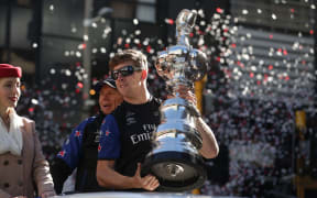 Peter Burling holds America's Cup after Team New Zealand won the event in Bermuda.