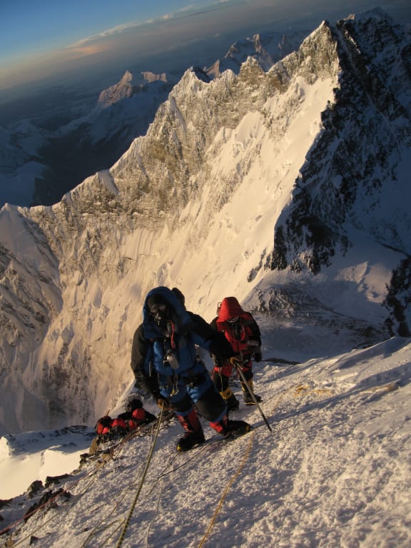 Unidentified mountaineers walk past the Hillary Step 29 May 2013.