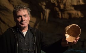 Israeli Professor Hershkowitz shows part of partial skull found in the Manot Cave.