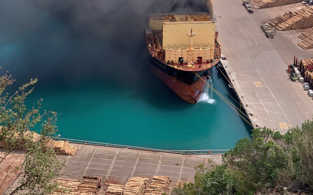 Huge clouds of smoke billow out of a container ship at Napier Port on 18 December, 2020.
