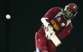 West Indies batsman Chris Gayle hits a six.