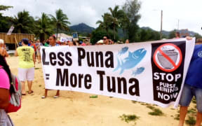 Cook Islanders march to decry the Prime Minister Henry Puna and his government's deal with the European Union on purse seine fishing.