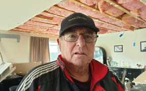 Barry Hobson at his damaged home.