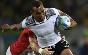 Fiji's Osea Kolinisau scores a try in the men’s rugby sevens gold medal match.