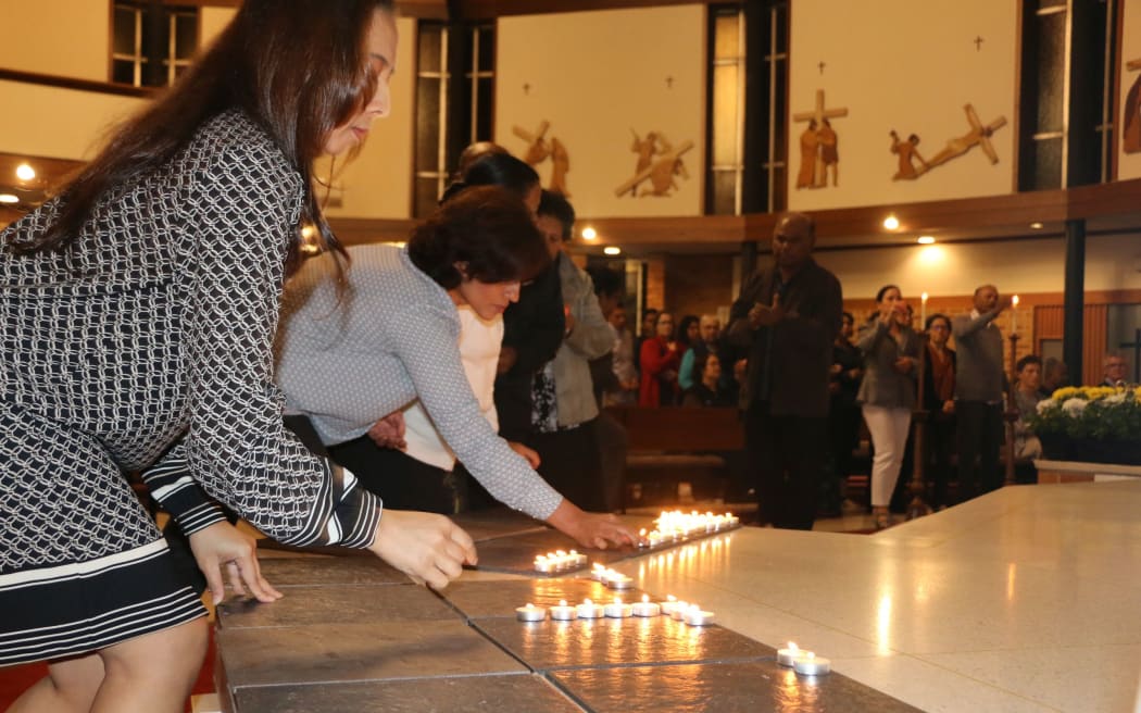 People lit candles at a special service in Auckland's Northcote to remember the victims.
