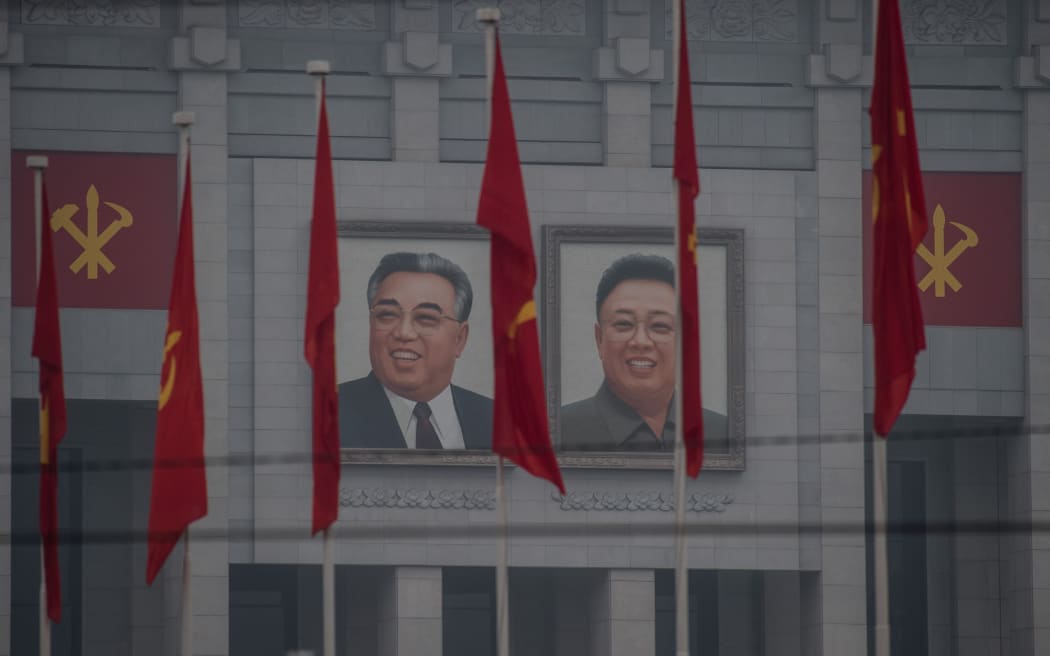 Portraits of late North Korean leaders Kim Il-Sung and Kim Jong-Il on the 'April 25 Palace', the venue of the 7th Workers Party Congress in Pyongyang.
