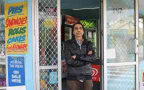 A photo of Kamlesh Patel outside his Opawa dairy. He says he will fight anyone who tries to robs his store