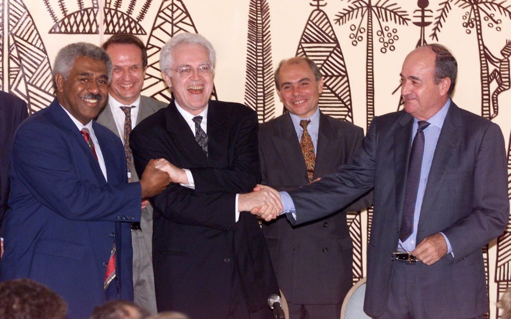 French Prime Minister Lionel Jospin, centre, shakes hands with the leader of the Kanak group FLNKS, Roch Wamytan (left) and Jacques Lafleur, the president of the loyalists group after the signing of the Noumea Accord in 1998.