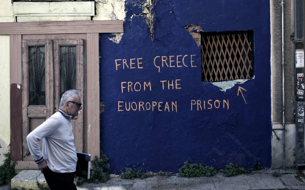 Anti-austerity graffiti on an abandoned house in Athens.