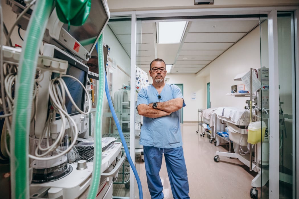 Dr Alberto Ramirez - lead anaesthetist at Palmerston North hospital - stands in corridor used to store expensive equipment.