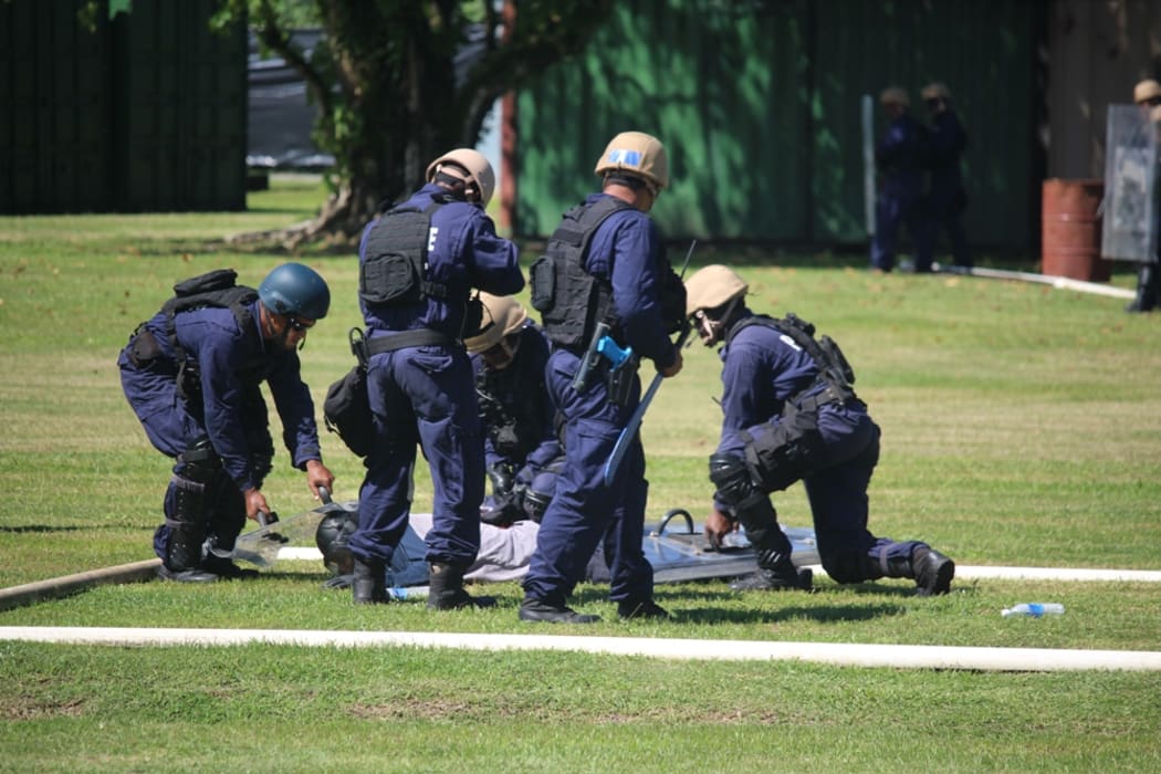 Solomon Islands Police put on public order management demonstration at GBR RAMSI base.