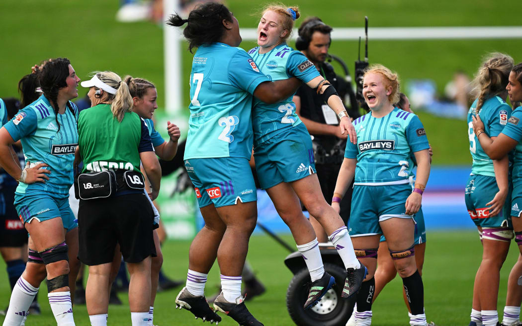 Matatū players Ona Palu and Grace Brooker celebrate their win over the Blues.