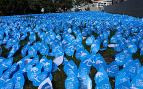 Thousands of blue paper water drops were shaped to form a river at the steps of Parliament. Campaigners walked more than 300km to present the a petition.