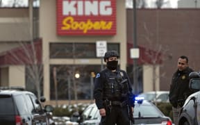 Police officers secure the perimeter of the King Soopers grocery store in Boulder, Colorado.