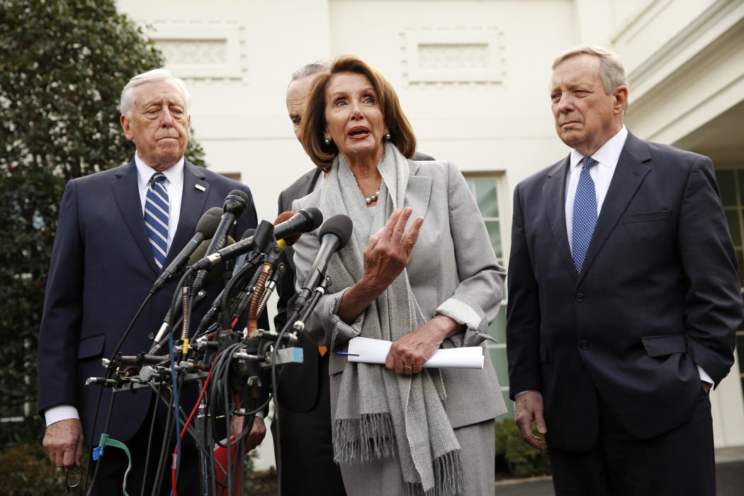 US House of Representatives speaker Nancy Pelosi (Dem, California) talks to reporters after meeting with US President Donald Trump, flanked by US House Majority Leader Steny Hoyer (Dem, Maryland), US Senate Minority Leader Chuck Schumer (Dem, NY) and US Senator Dick Durbin (Rep, Illinois).