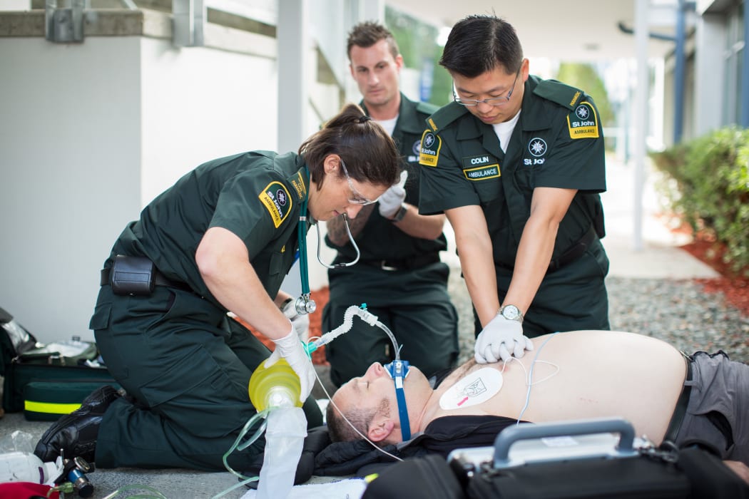 St John Ambulance paramedics performing CPR
