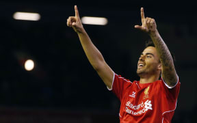 Liverpool's Suso celebrates after scoring during the League Cup soccer match against Middlesbrough.