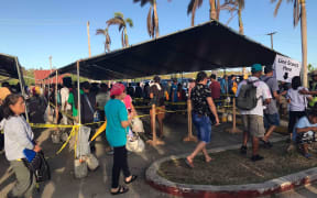 People lining up for food stamps in the CNMI after Typhoon Yutu