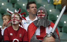 English rugby fans wait for the opening ceremony of the 2015 Rugby World Cup at Twickenham stadium in south west London on September 18, 2015.