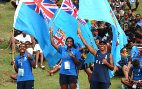 Pacific Games football semi-finals: Team Fiji create an island of blue surrounded by a sea of green supporters in the Solomon Islands vs Fiji semi-final at Lawson Tama Stadium in Honiara. 28 November 2023.  Credit RNZ Pacific/Koroi Hawkins